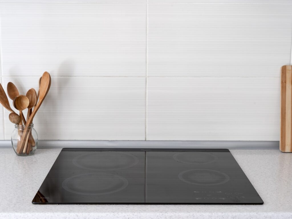 Empty flat cooktop in kitchen